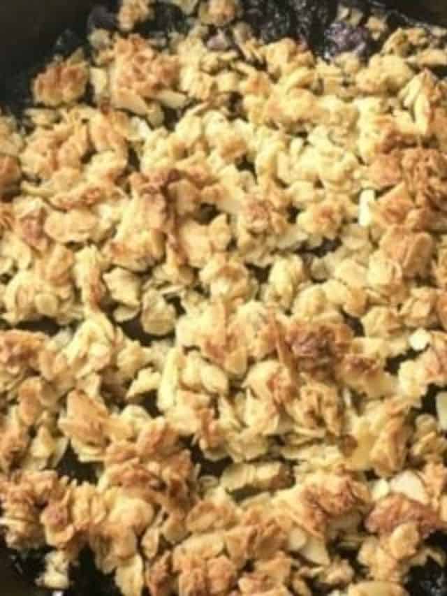 Blueberry crumble in a skillet.