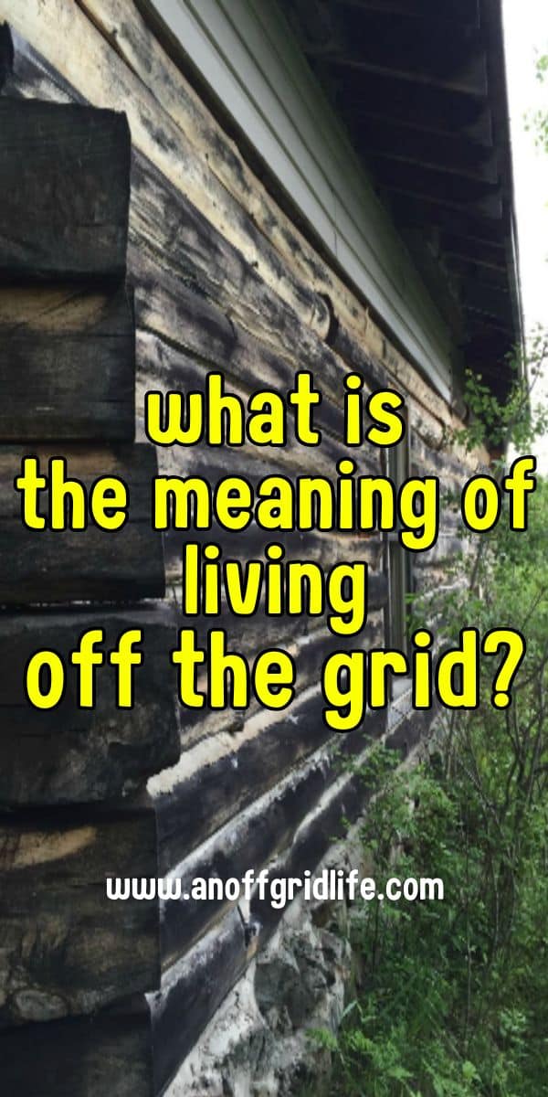 Weathered log cabin with text overlay asking, "What is the meaning of living off the grid?" and a website URL at the bottom.