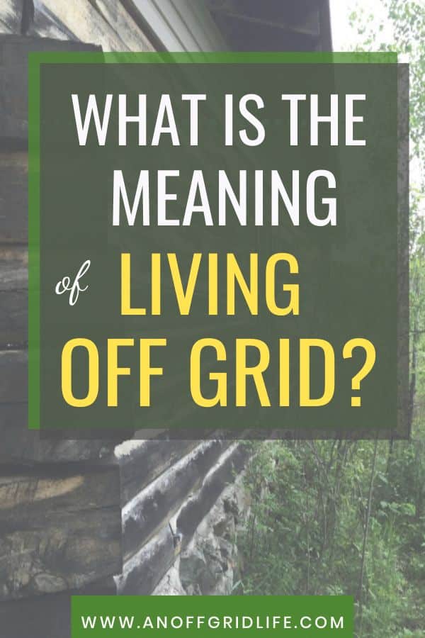Sign with the text "What is the meaning of living off grid?" is shown, with part of a wooden cabin and greenery in the background. Website "www.anoffgridlife.com" appears at the bottom.
