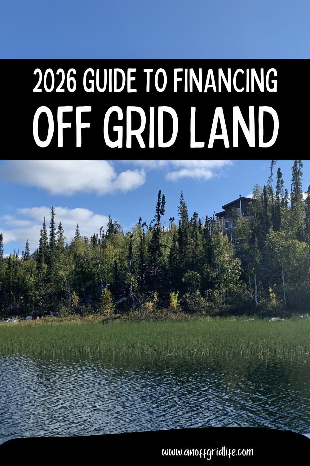 Lake with a forested shoreline and a house visible among the trees; overlaid text reads "2026 Guide to Financing Off Grid Land.