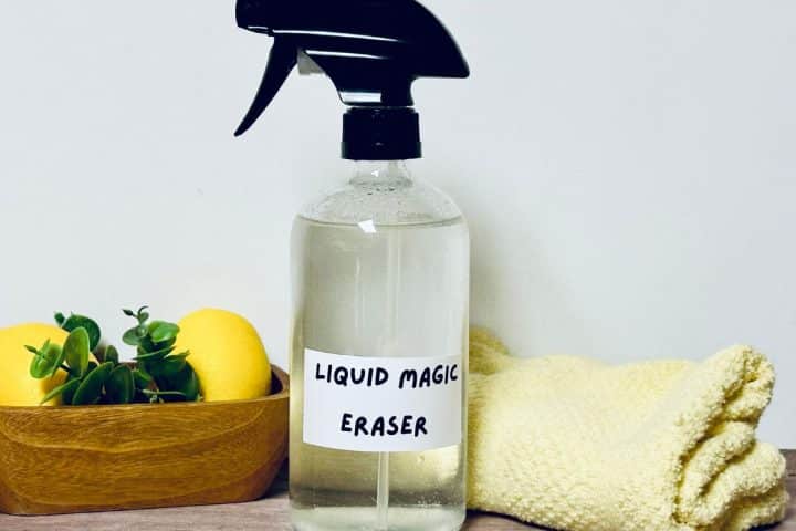 Lemons with DIY magic eraser in spray bottle and a washcloth.