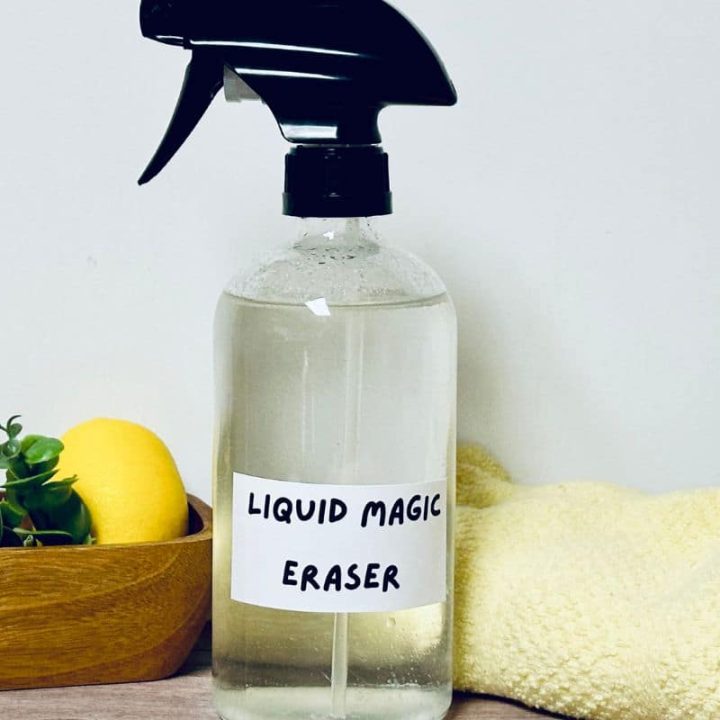 Lemons with DIY magic eraser in spray bottle and a washcloth.