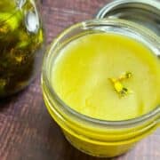 Dandelion oil and salve in glass jars.
