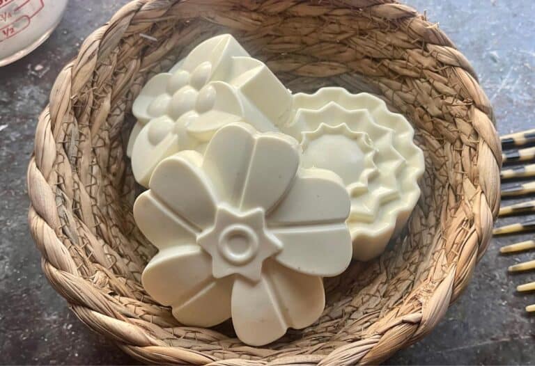 White flower soap in a wicker basket.
