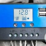 Charge controller on a wall showing voltage