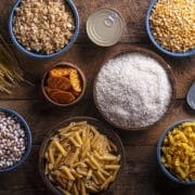 Various types of food on a wooden table.