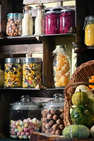 Pantry shelves with mason jars and baskets.