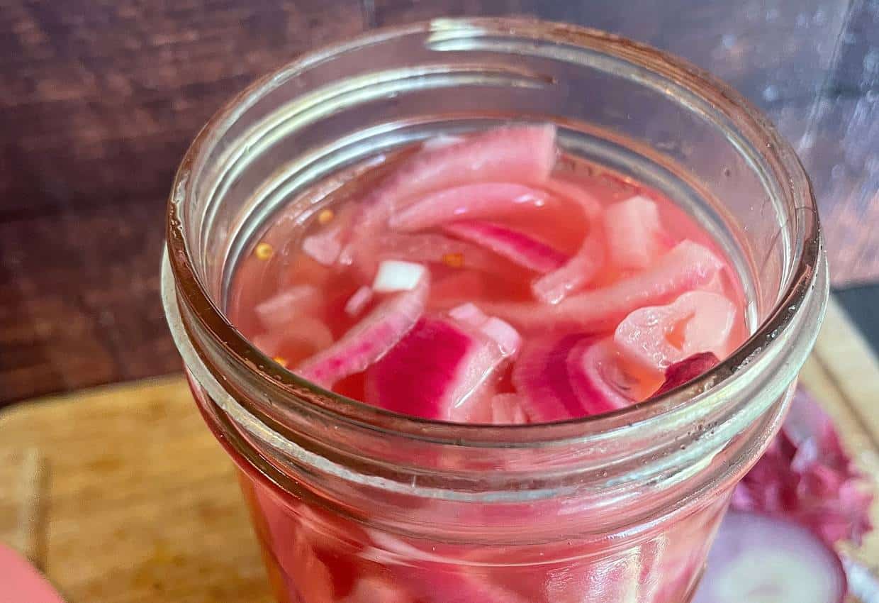 Sliced pickled red onions in jar -close up