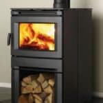 A wood burning stove with logs in it.