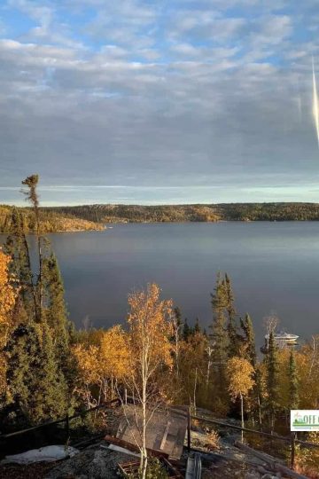 Autumn View of trees changing color and lake in background - why we live off the grid in the subarctic