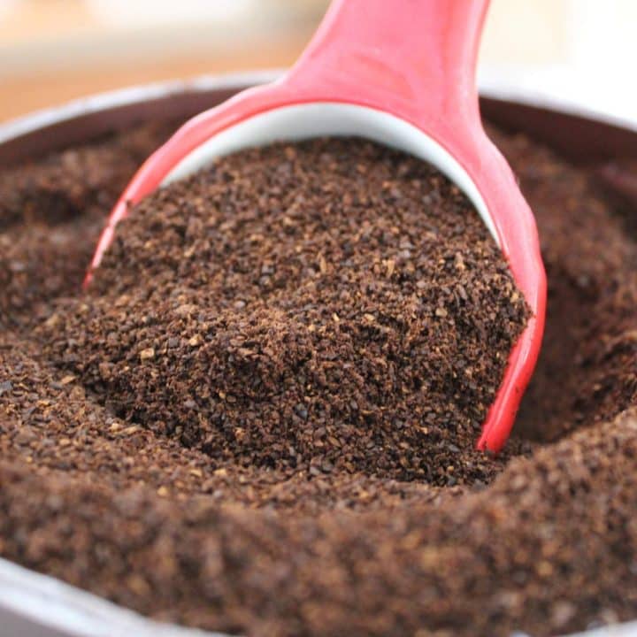 A scoop of coffee granules in a bowl.