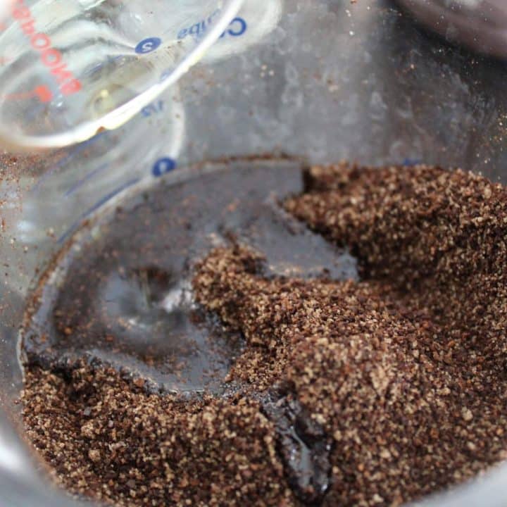 A bowl filled with a mixture of brown sugar and cocoa powder.