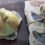Onion wrapped in paper and tied with twine.