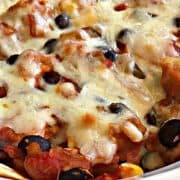 A casserole dish filled with black beans and cheese.