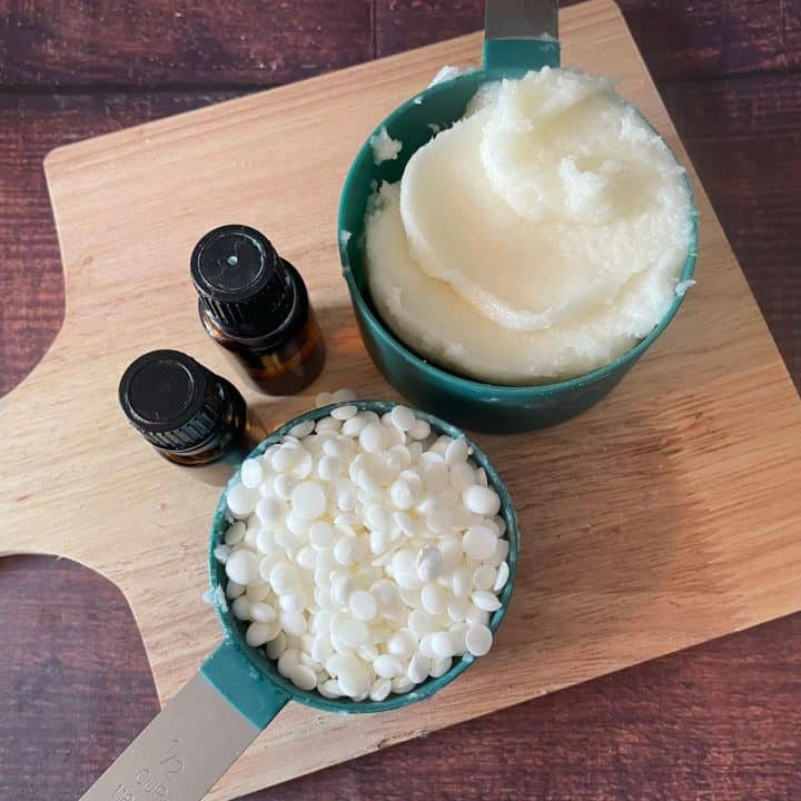 A wooden cutting board with ingredients for homemade wood butter recipe.